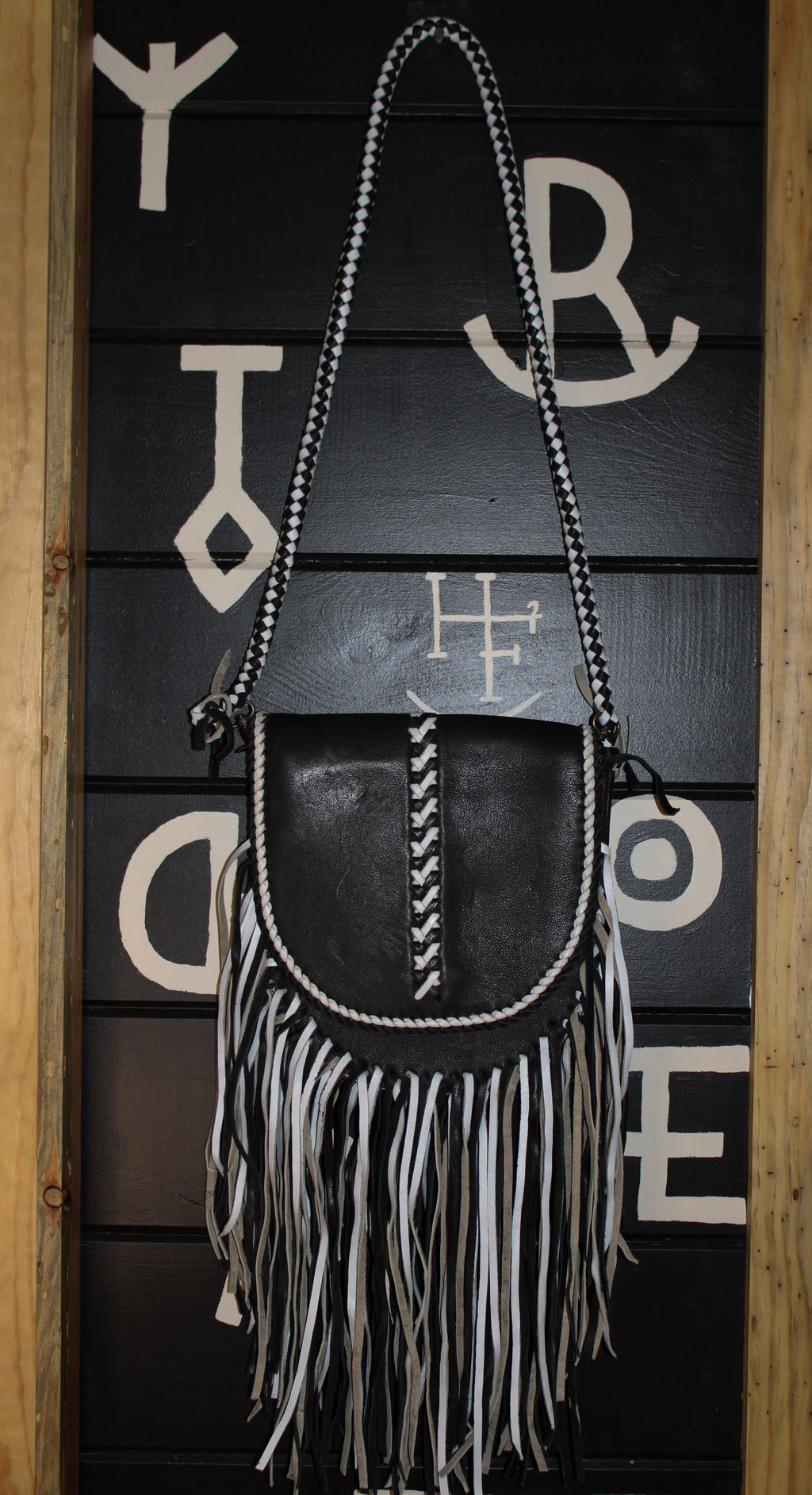 Black leather and fringe crossbody