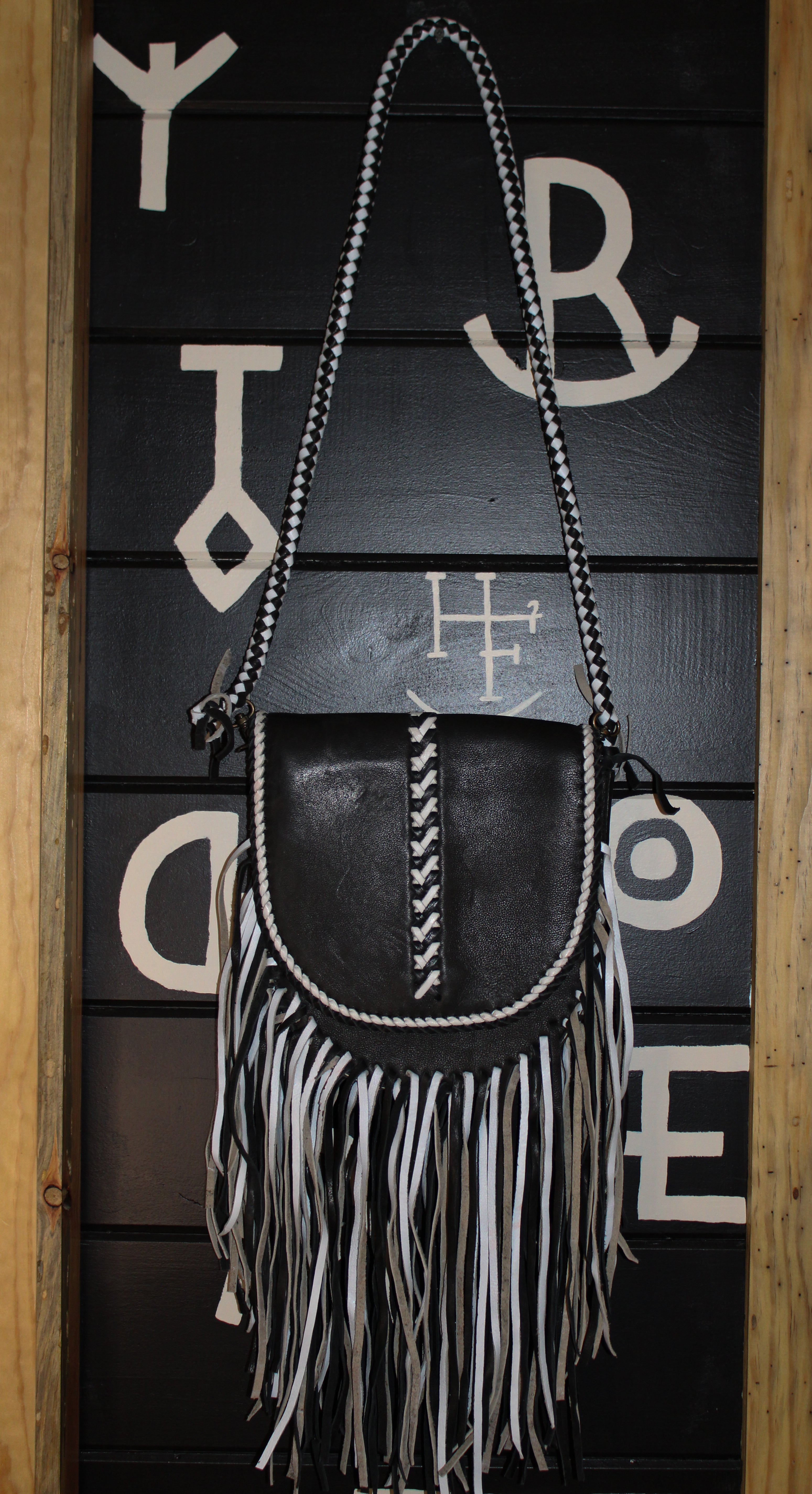 Black leather and fringe crossbody