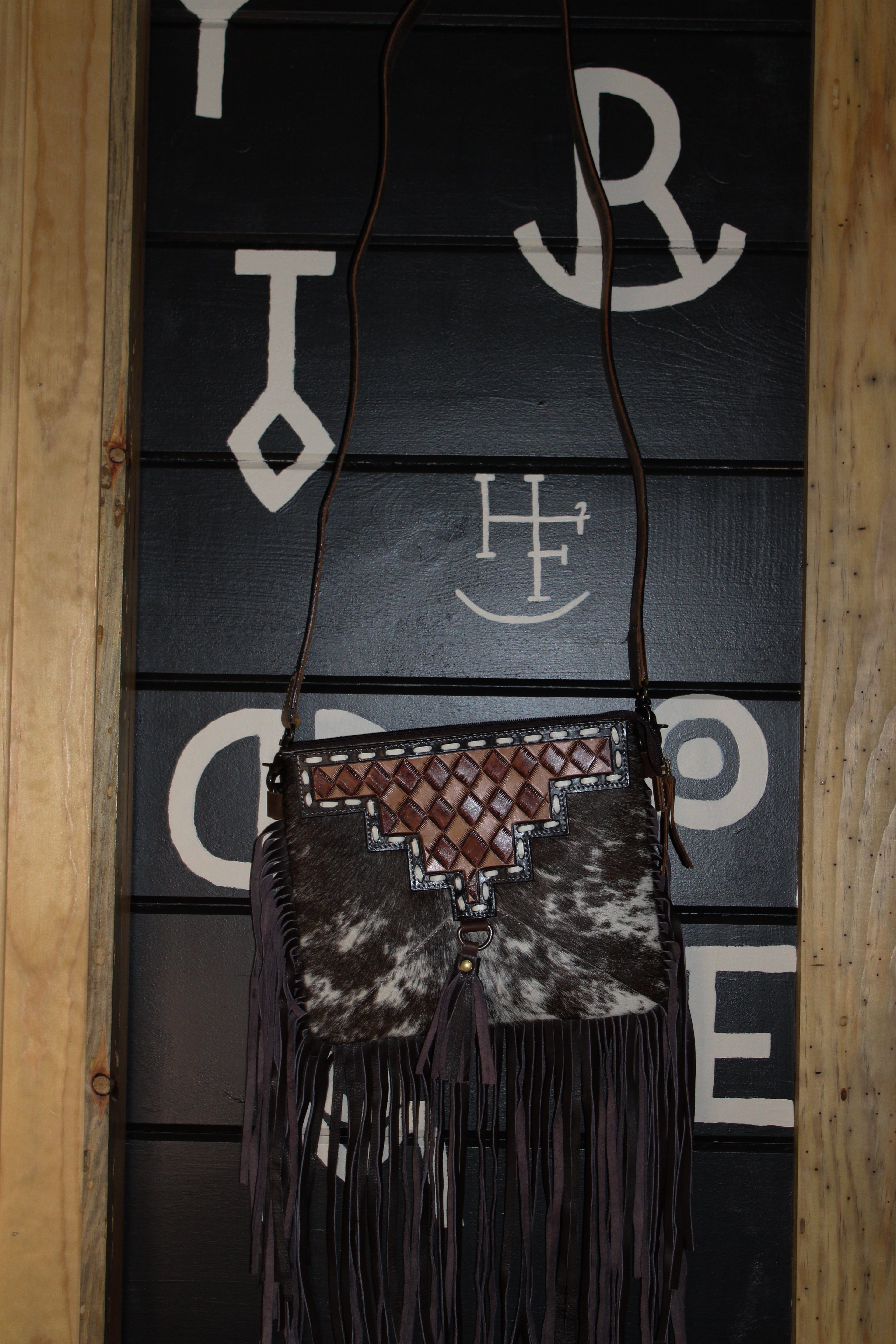 Brown checkered tooled and cowhide fringe crossbody