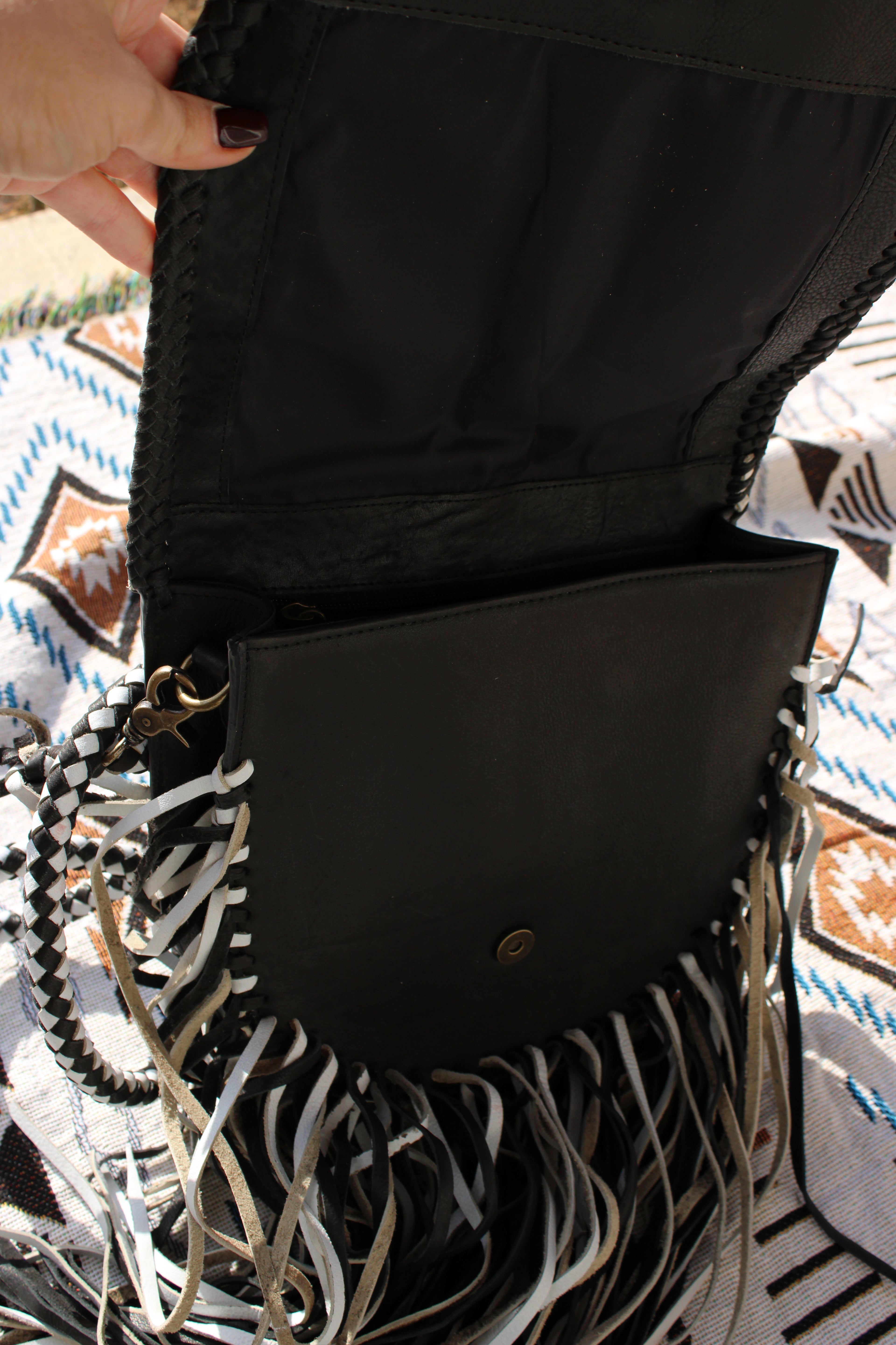 Black leather and fringe crossbody