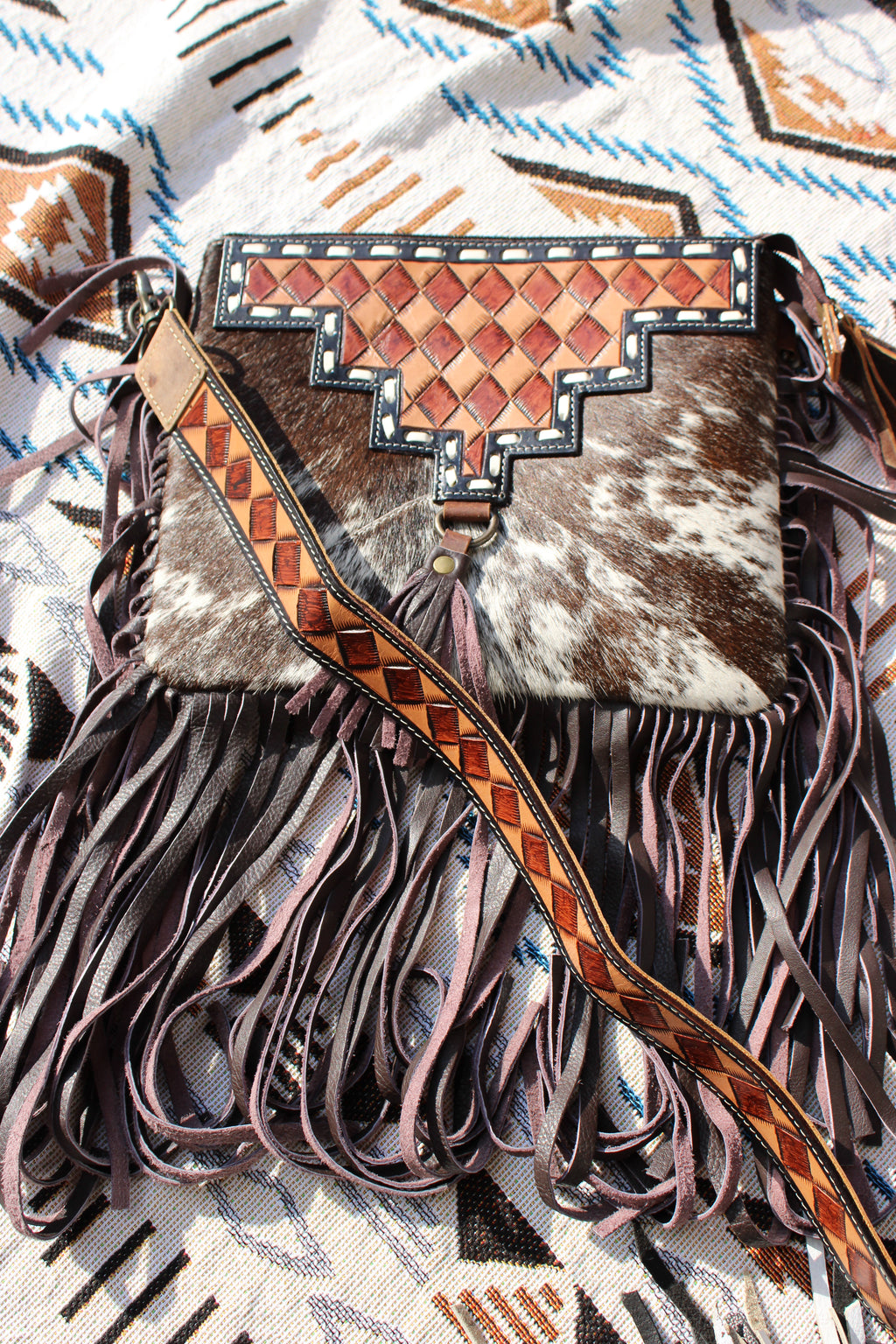 Brown checkered tooled and cowhide fringe crossbody